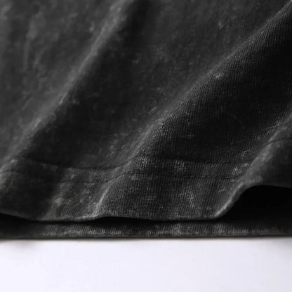 Black velvet fabric with soft plush texture and subtle sheen on japanese takoyaki graphic oversized cotton t-shirt