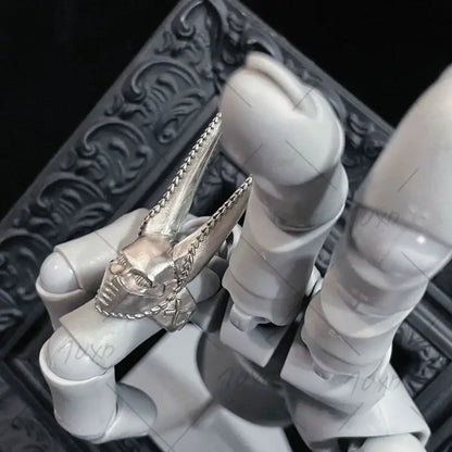 Silver skull ring with pointed horns and chain detailing adjustable cosplay accessory from jojo’s bizarre adventure d4c steel ball run