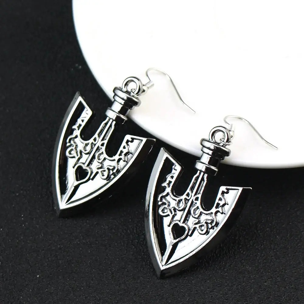 Silver and black axe-shaped drop earrings with intricate engravings for jojo’s bizarre adventure cosplay jewelry