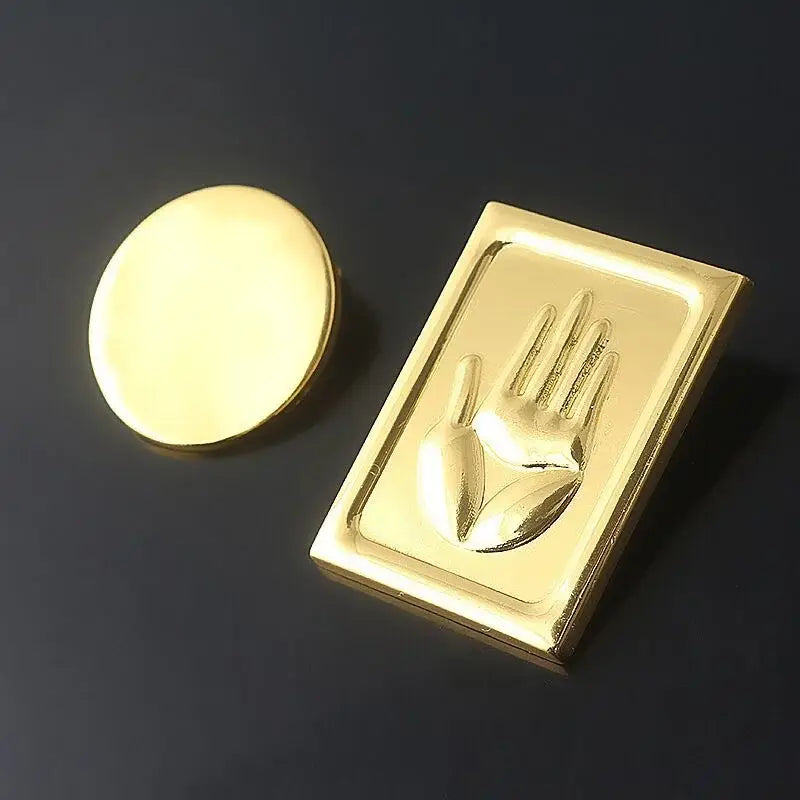 Gold-colored metal badge featuring a raised hand design with matching cap for jojo’s bizarre adventure kujo jotaro cosplay
