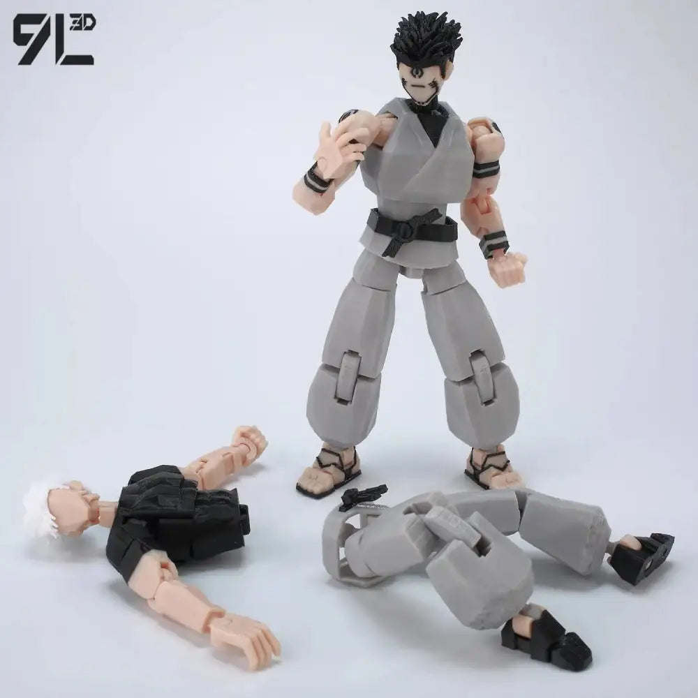 Gray jujutsu kaisen gojo articulated action figure in martial arts uniform with black belt standing over disassembled parts