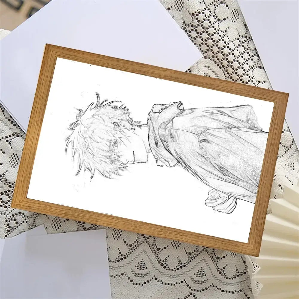 A framed pencil sketch of gojo from jujutsu kaisen in a light wood frame used as light painting decor