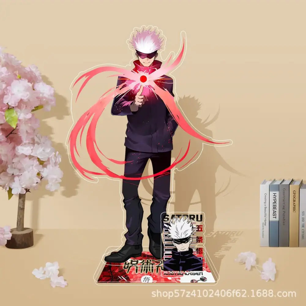 Clear acrylic stand featuring gojo satoru from jujutsu kaisen in black outfit with white hair and red energy effects