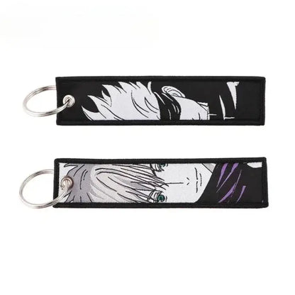 Black embroidered jujutsu kaisen gojo satoru keychain with white and purple anime character accents bag charm