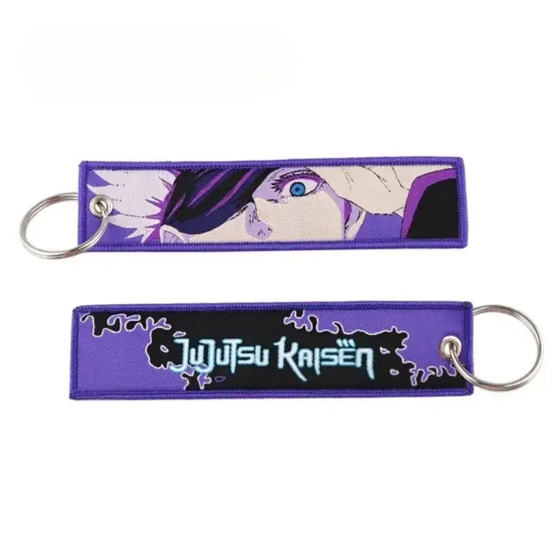 Purple embroidered jujutsu kaisen gojo satoru keychain with blue eyes black hair and stylized kaisen gojo title
