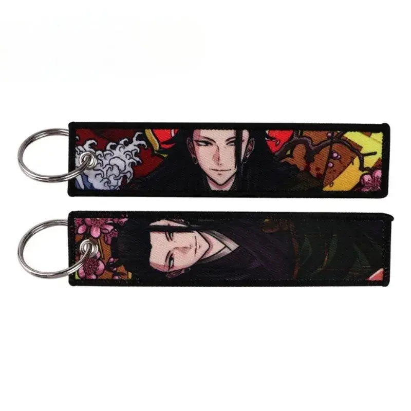 Two rectangular embroidered jujutsu kaisen gojo satoru keychains with silver metal rings for bag charm use