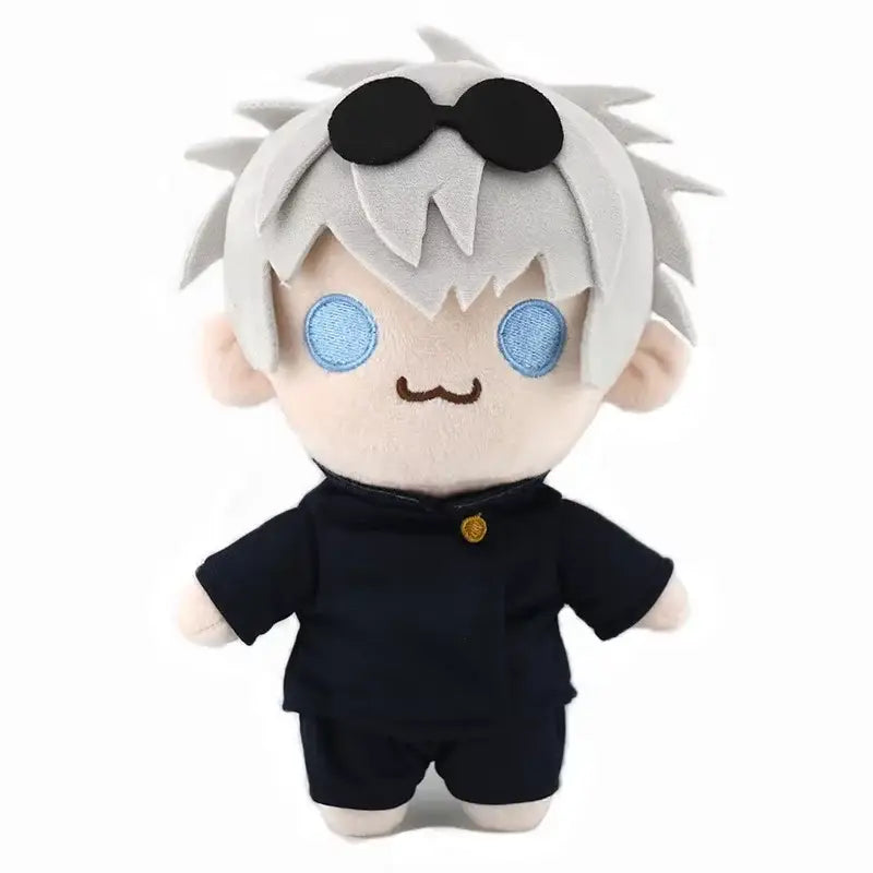 Plush toy of jujutsu kaisen gojo satoru with spiky white hair, blue eyes, black sunglasses, and navy-blue uniform