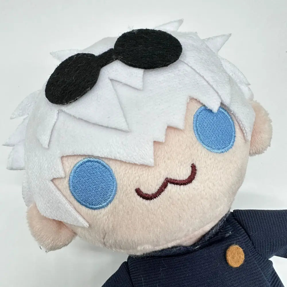 A jujutsu kaisen gojo satoru plush with white spiky hair blue embroidered eyes and black sunglasses soft cosplay doll