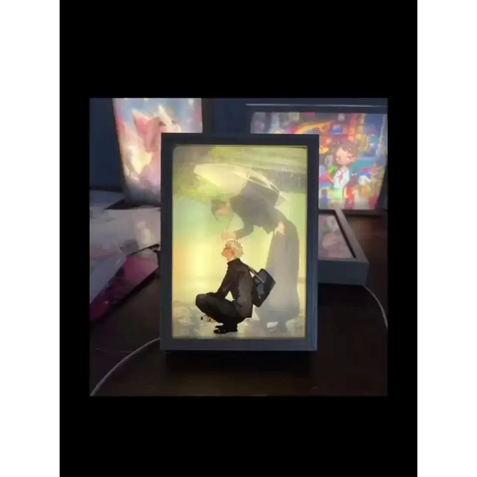 Black-framed jujutsu kaisen gojo satoru led light frame with usb plug-in featuring anime-style kneeling figure under umbrella