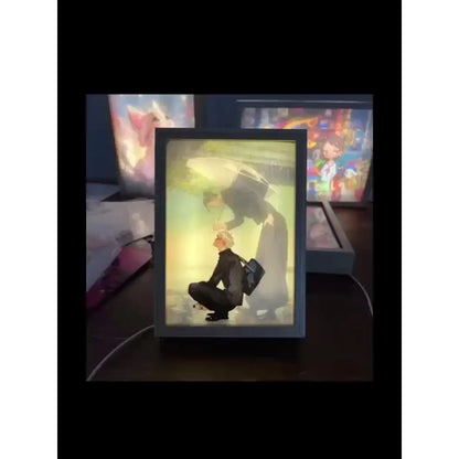 Black-framed jujutsu kaisen gojo satoru led light frame with usb plug-in featuring anime-style kneeling figure under umbrella