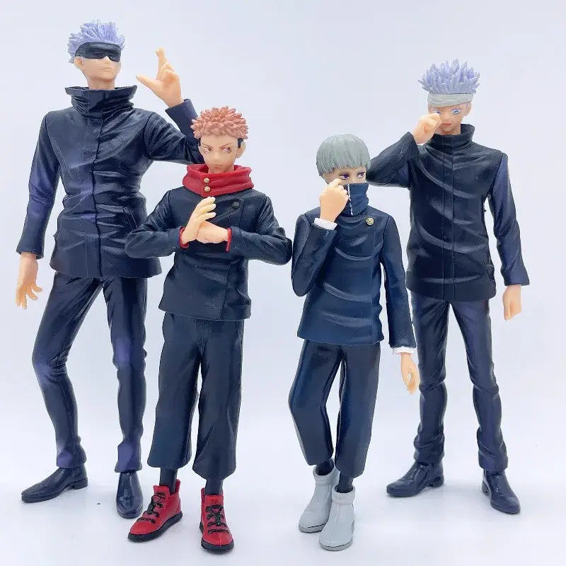 Four jujutsu kaisen action figures in dark blue and black uniforms with one in red boots display quality figure set