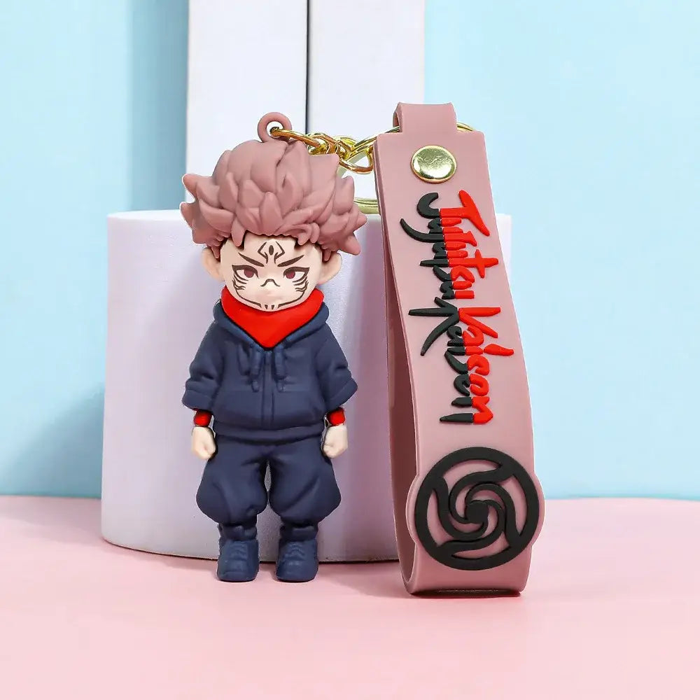 Pink and navy blue vinyl jujutsu kaisen gojo satoru plush keychain featuring chibi yuji itadori with red scarf accents