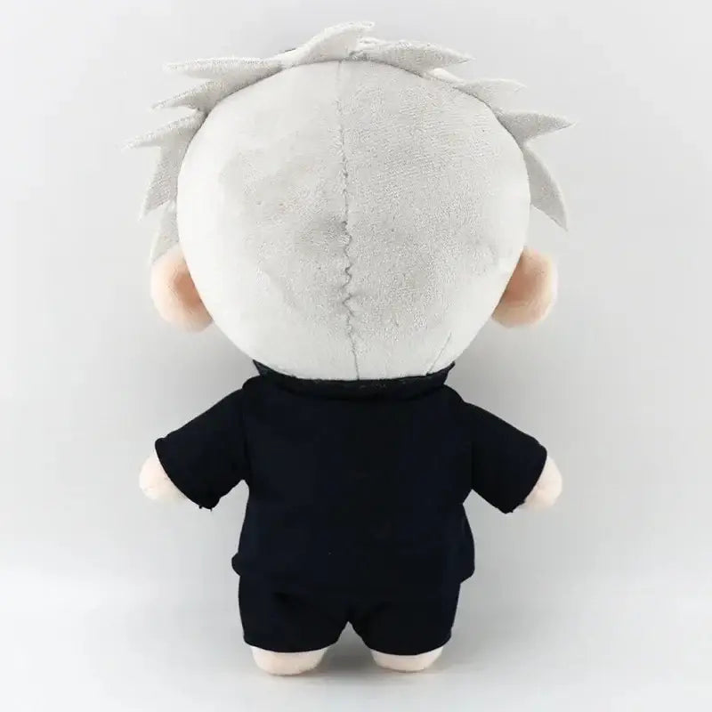 A plush toy of jujutsu kaisen gojo satoru with white spiky hair and a black outfit soft cosplay plush