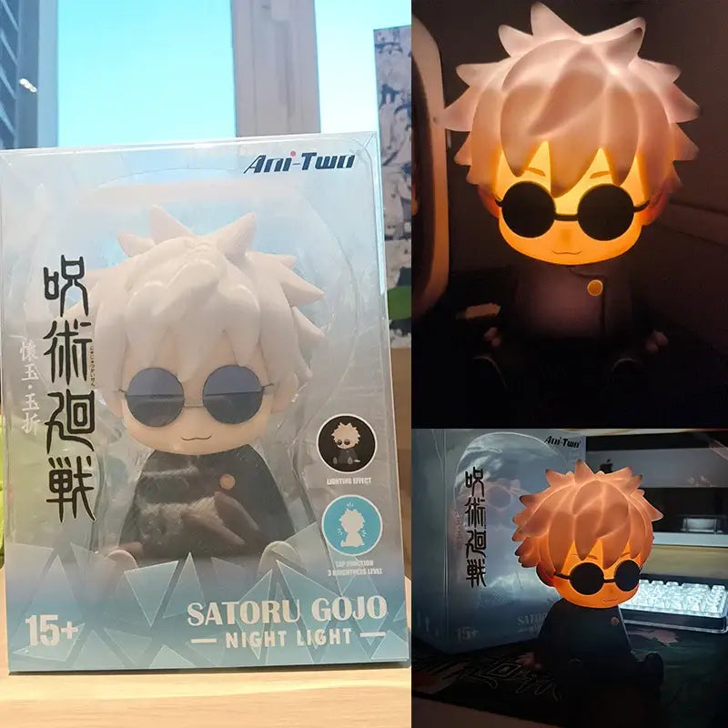 A glowing chibi-style satoru gojo silicone night light with spiky white hair and black sunglasses for desk use