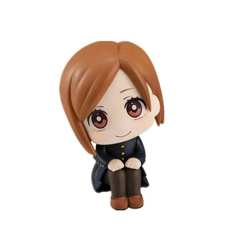 Chibi jujutsu kaisen gojo satoru sitting doll figurine with short brown hair red eyes black coat and brown pants