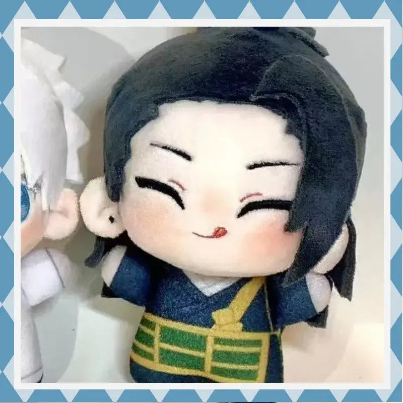 A jujutsu kaisen suguru geto plush wearing a blue outfit with green and yellow accents and black hair smiling face