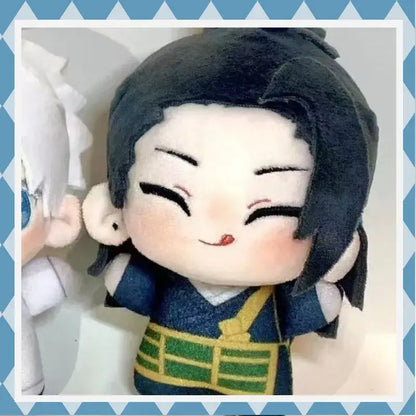 A jujutsu kaisen suguru geto plush wearing a blue outfit with green and yellow accents and black hair smiling face