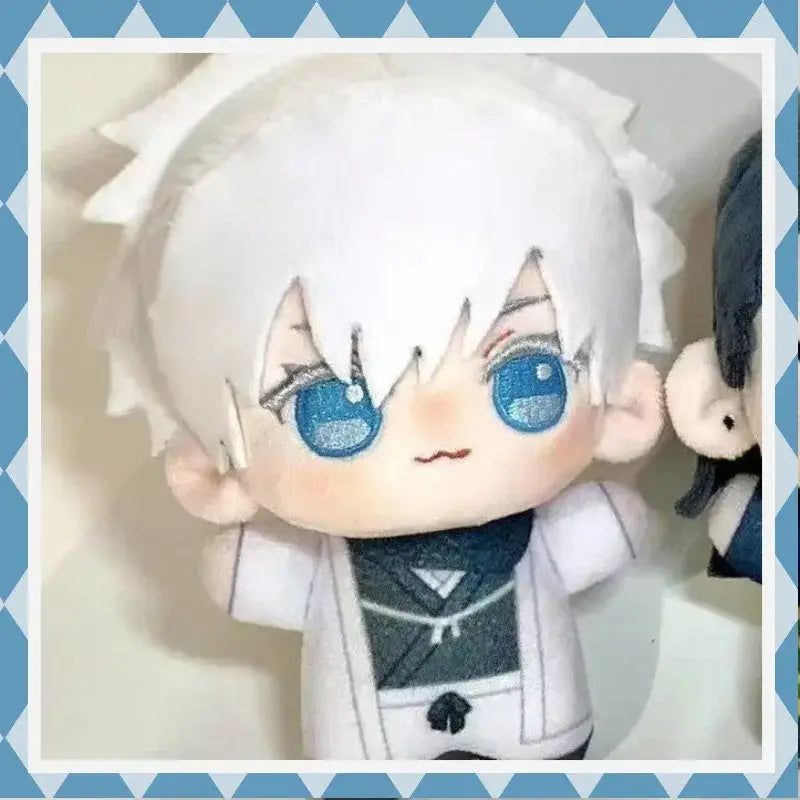 A 10cm jujutsu kaisen gojo satoru plush with white spiky hair, blue glittery eyes, and white outfit with dark green accents