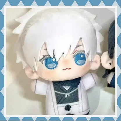 A 10cm jujutsu kaisen gojo satoru plush with white spiky hair, blue glittery eyes, and white outfit with dark green accents