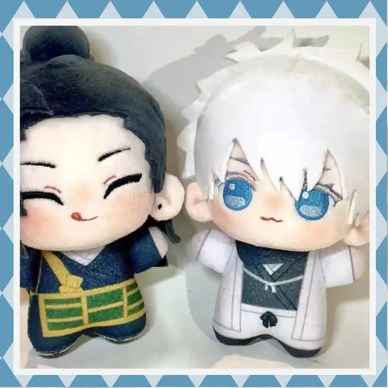 Two plush anime dolls featuring gojo satoru with white hair and suguru geto plush in navy with green trim from jujutsu kaisen