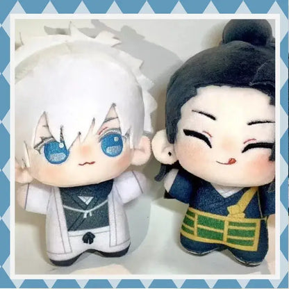 Two plush jujutsu kaisen dolls featuring gojo satoru in white coat and suguru geto plush in navy traditional wear