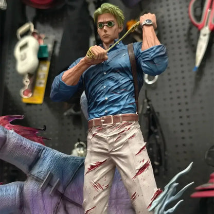 Detailed nanami kento pvc statue from jujutsu kaisen featuring green hair, round goggles, blue shirt, and stained beige pants