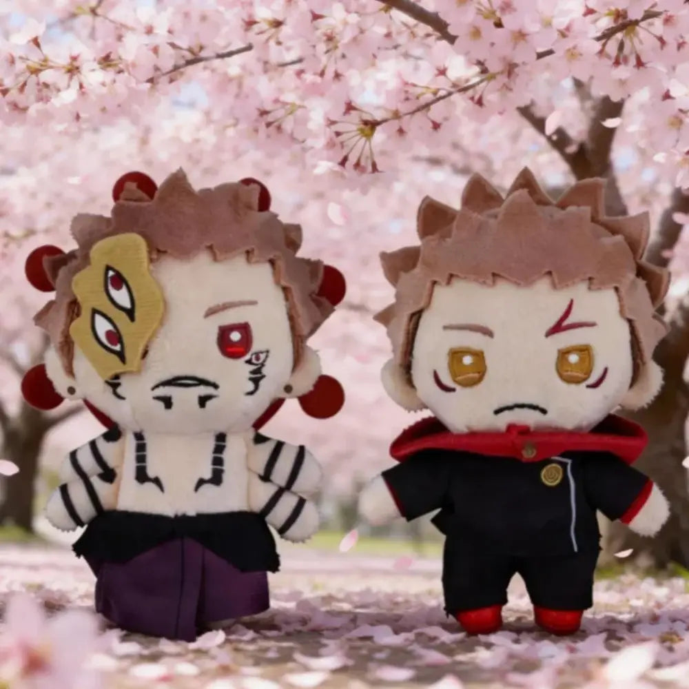 Two jujutsu kaisen plush dolls with spiky brown hair wearing black and white striped top and black jacket plush pendant
