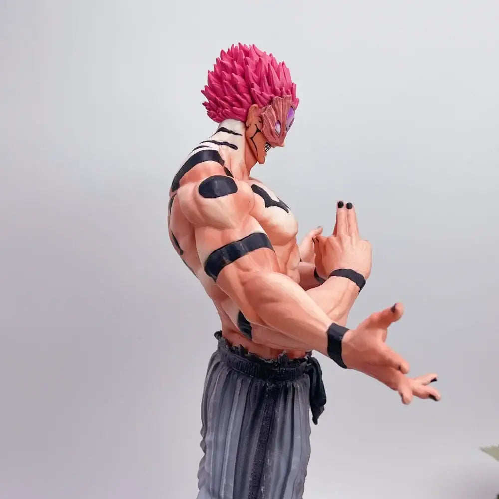 Detailed muscular pvc statue of jujutsu kaisen ryomen sukuna with vibrant pink hair and black markings wearing gray pants