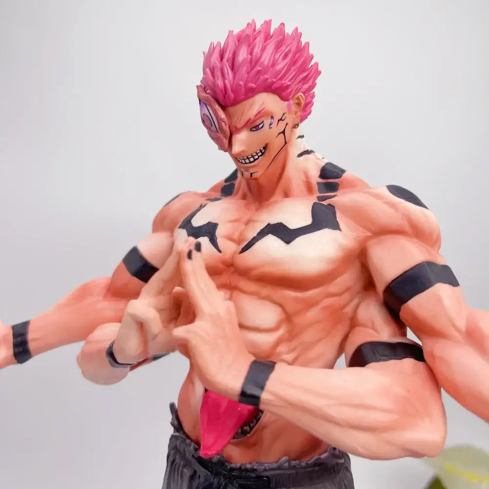 Detailed jujutsu kaisen ryomen sukuna pvc statue with muscular build, vibrant pink hair, and black tribal markings