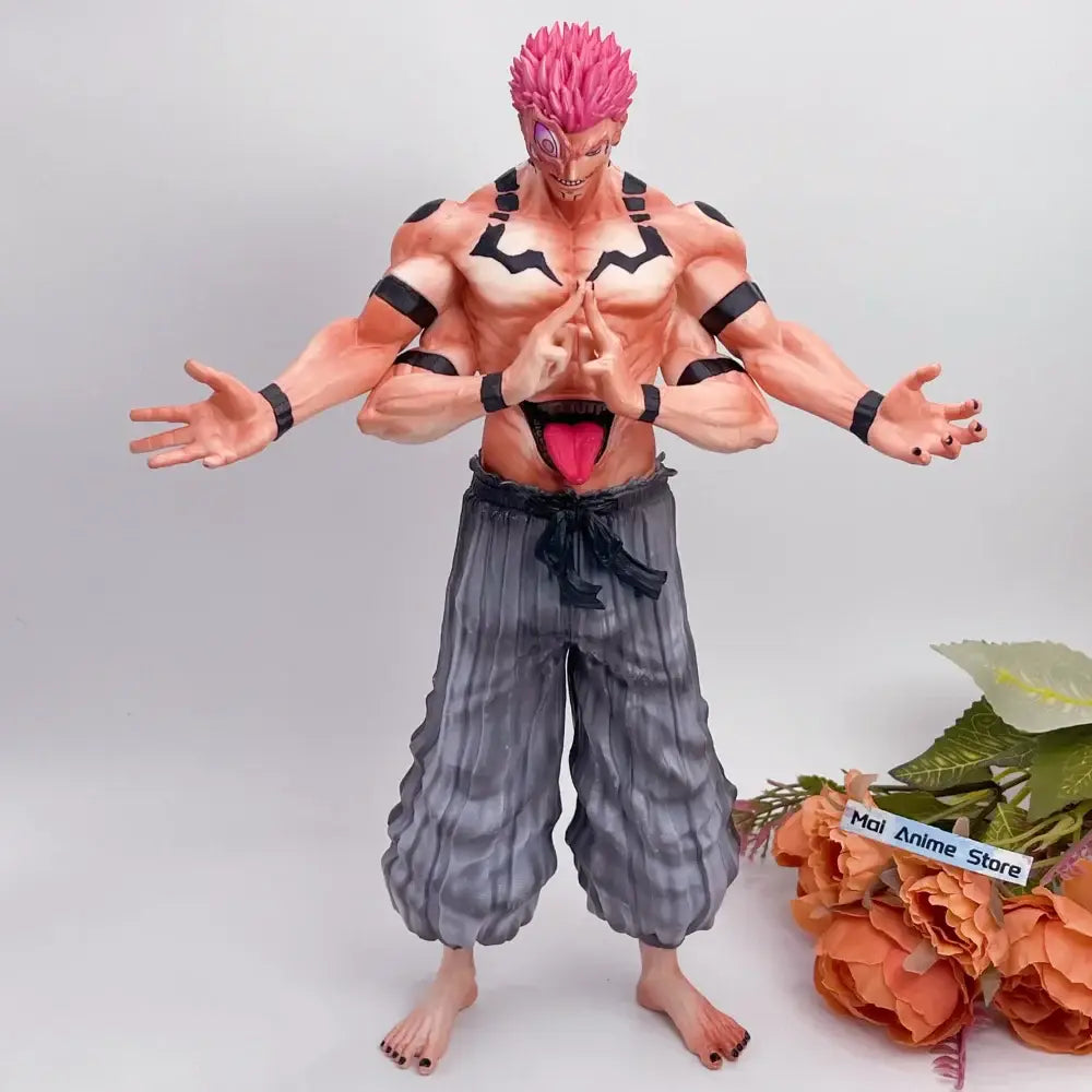 Detailed pvc figurine of jujutsu kaisen ryomen sukuna with spiky pink hair and black markings in gray pants