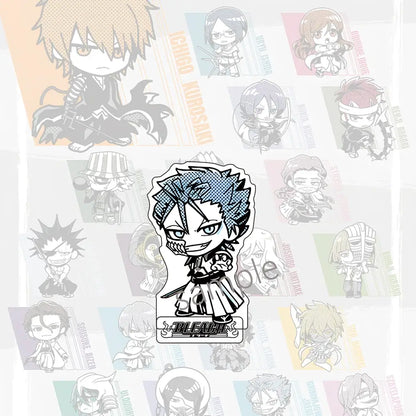 Blue and black chibi-style ichigo kurosaki acrylic badge paired with jujutsu kaisen sukuna clear acrylic stand
