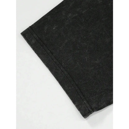 Black denim fabric with faded texture and visible stitching on hem of jujutsu kaisen toji fushiguro printed tee in washed cotton