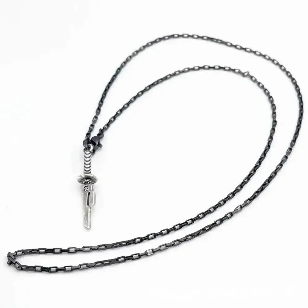 A sleek dark-toned chain necklace with a silver jujutsu kaisen toji fushiguro sword pendant featuring engraved blade and textured hilt