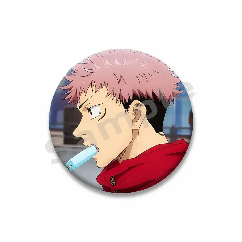 Circular yuji itadori enamel pin featuring spiky pink hair and red jacket holding a light blue object in mouth