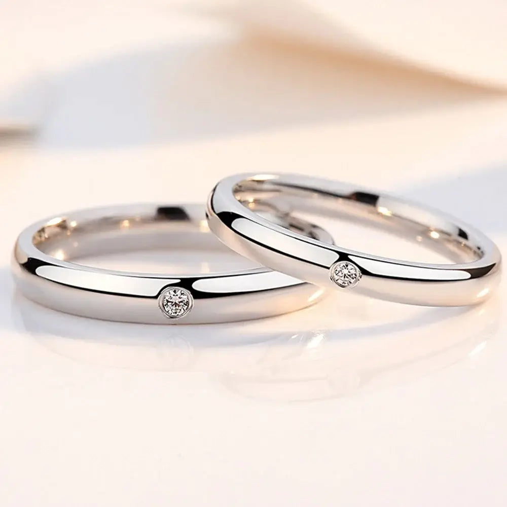 A pair of sleek silver-toned jujutsu kaisen yuta okkotsu cosplay rings with polished finish and center diamonds