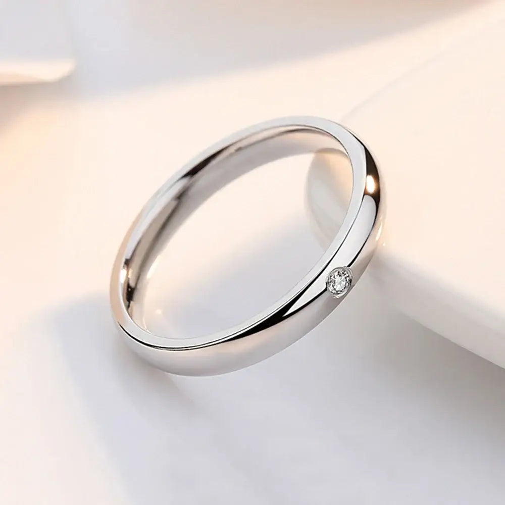A sleek silver jujutsu kaisen yuta okkotsu cosplay ring with a single round-cut diamond set on its side