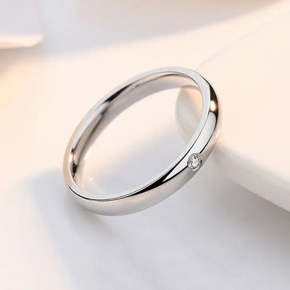 A sleek silver jujutsu kaisen yuta okkotsu cosplay ring with a single round-cut diamond set on its side