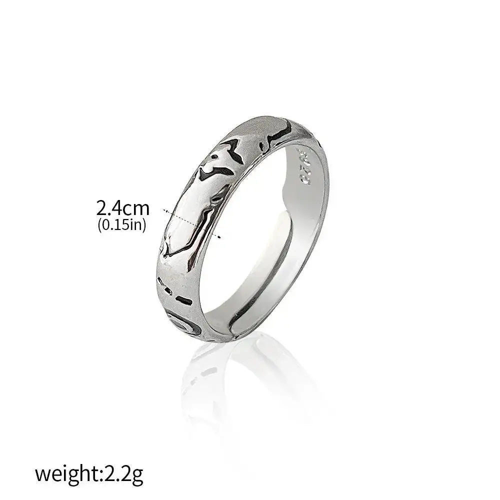 Silver jujutsu kaisen yuta okkotsu couple ring with intricate black engraved patterns along its band