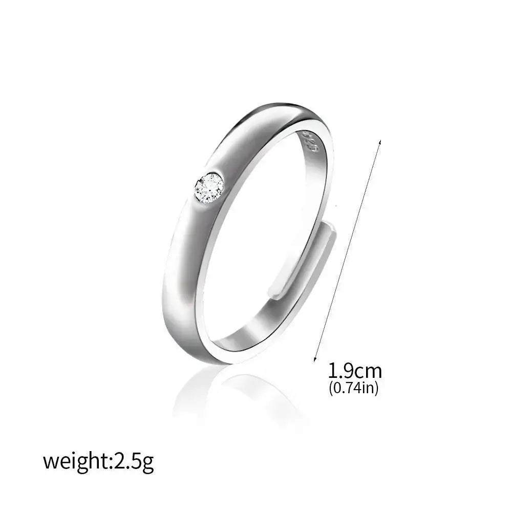 A sleek silver adjustable jujutsu kaisen yuta okkotsu couple ring with a single round diamond on its band