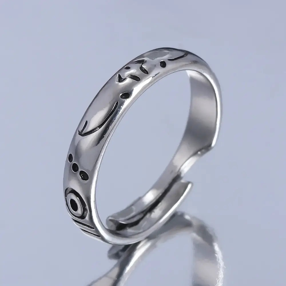 Silver adjustable jujutsu kaisen yuta okkotsu couple ring with intricate engraved patterns and black oxidized accents