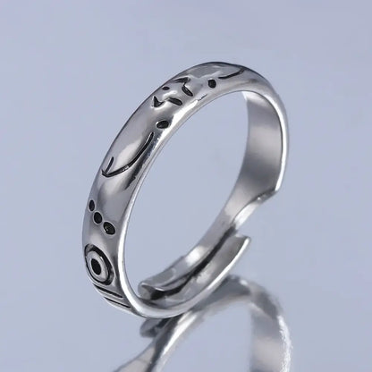 Silver adjustable jujutsu kaisen yuta okkotsu couple ring with intricate engraved patterns and black oxidized accents