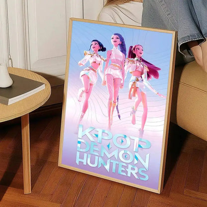 A framed k-pop demon hunters wall art sticker featuring three animated female characters in white and gold outfits
