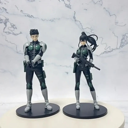 Two detailed pvc statue action figures in black and green tactical gear featuring kafka hibino monster form design