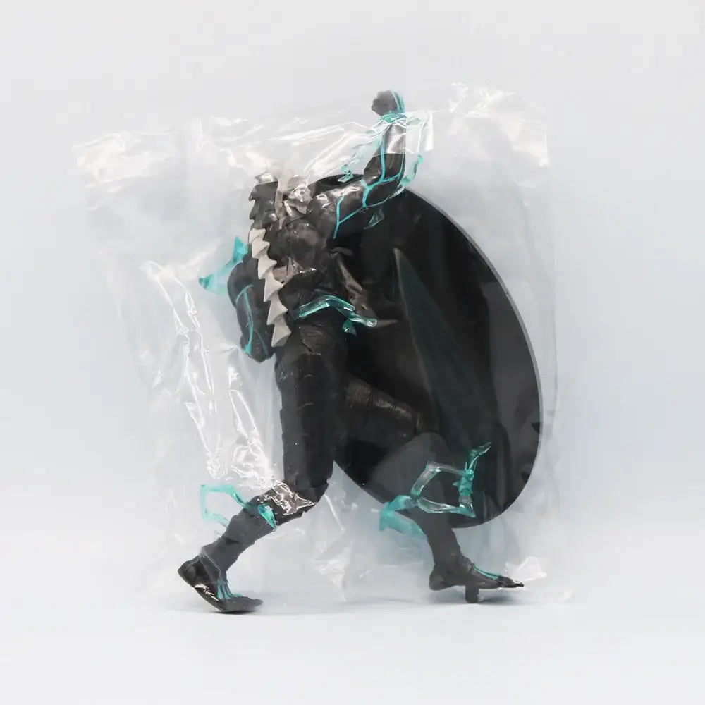 Kaiju No. 8 monster action figure in black and teal armor with flowing cape encased in high-grade PVC packaging