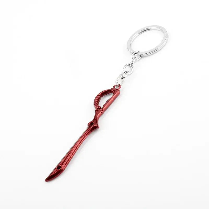 Red metallic mini metal keychain shaped like a scissor blade with a silver ring and chain for kill la kill fans
