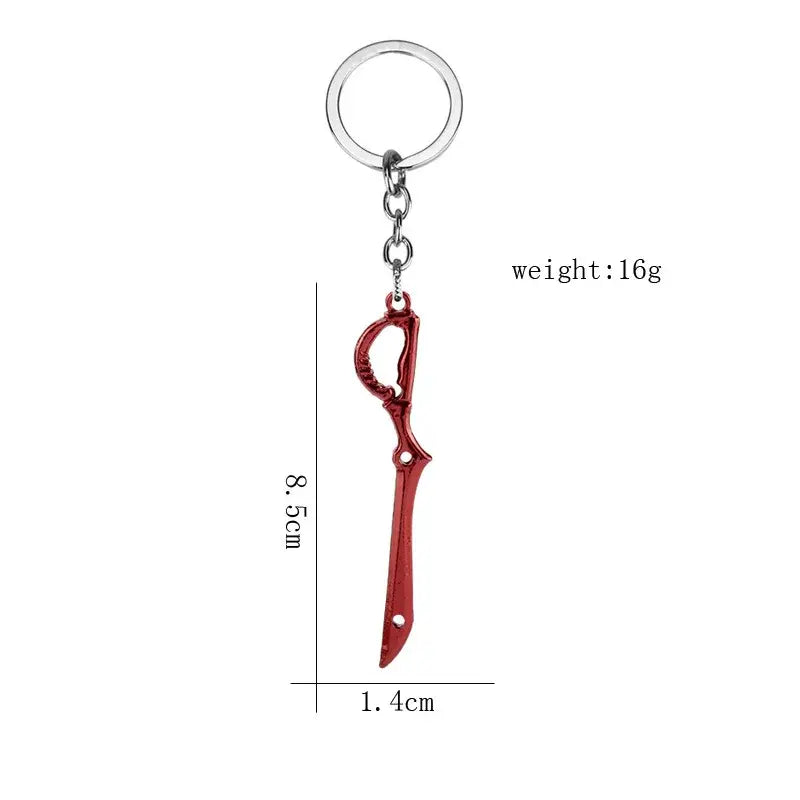 Red metallic mini metal keychain shaped like scissor blade sword with ornate hilt from kill la kill matoi ryuko