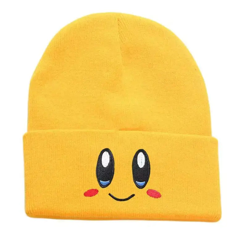 Bright yellow knit kirby plush hat featuring kawaii embroidered eyes rosy cheeks and a smiling mouth design