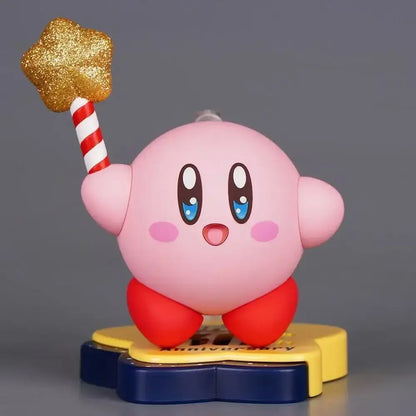 Pink kirby pvc figure 30th anniversary edition holding glittery gold star on red white striped stick on yellow blue base