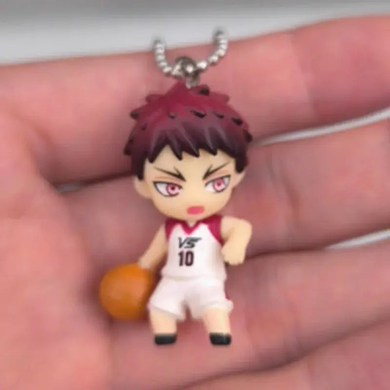 Kurokos basketball kise ryota pvc figure keychain featuring a chibi basketball player with maroon hair and white jersey