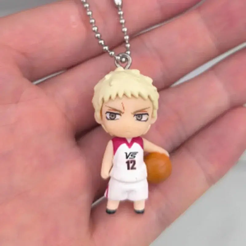 Kurokos basketball kise ryota small chibi pvc figure keychain with blonde hair and white red number 12 jersey holding ball